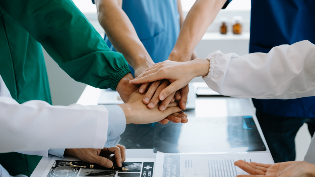 A leader or entrepreneur shaking hands with their team, showing gratitude.