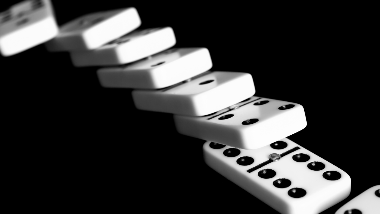 Domino effect illustration showing how small wins lead to larger successes.